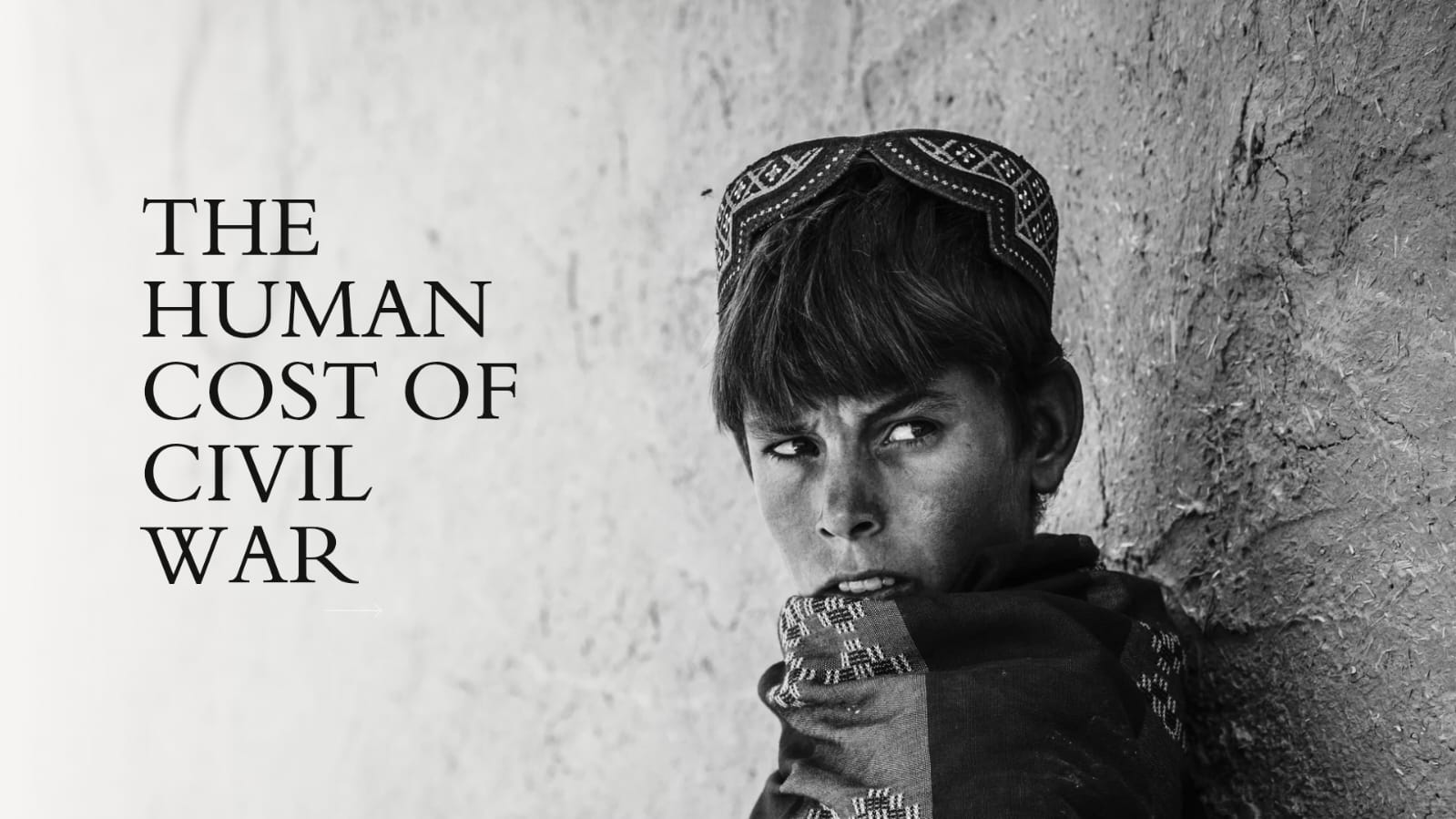 A young boy with a solemn expression leaning against a wall, representing the suffering of children caught in civil war