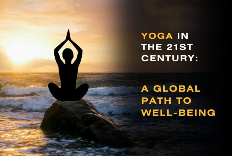 Silhouette of a person in a yoga pose on a rock by the ocean at sunset, representing yoga in the 21st century as a global path to well-being